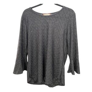 C’est La  Vie black blouse with small cutouts and one ruffle sleeve